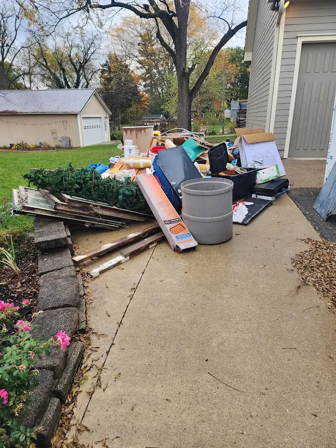 Dumpster being loaded with debris for 3 Yard Dumpster Rental in West Park